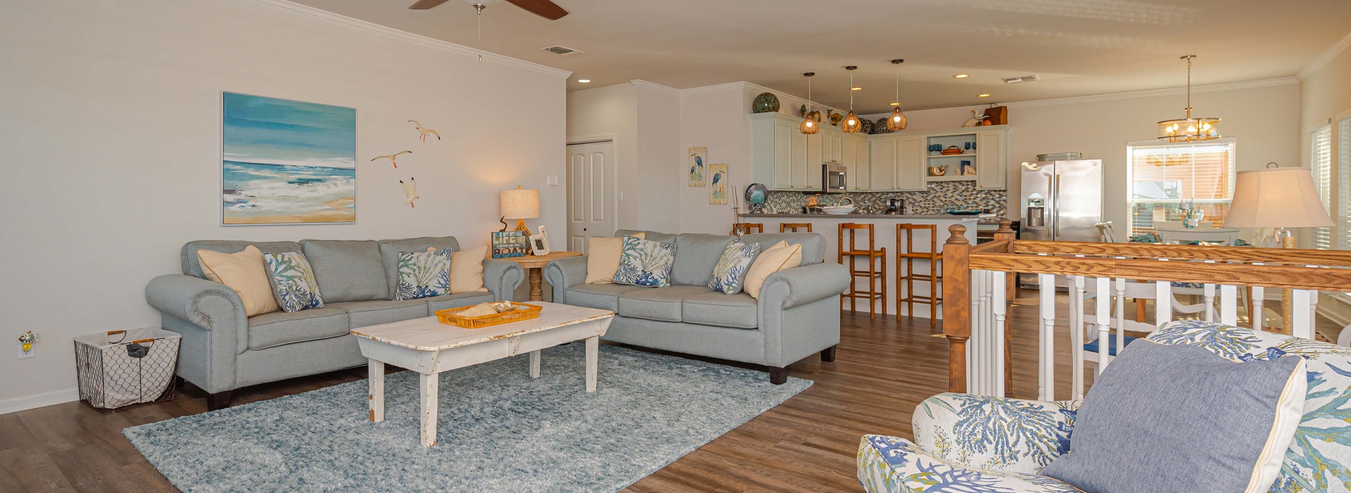 Bright coastal living room with water views