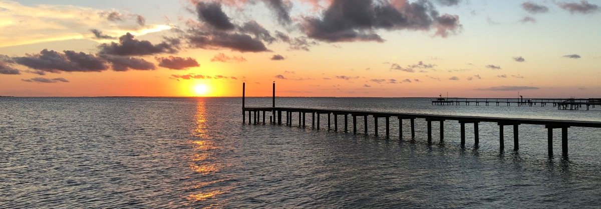 Fishing pier at sunset on the bay in Rockport, Texas
