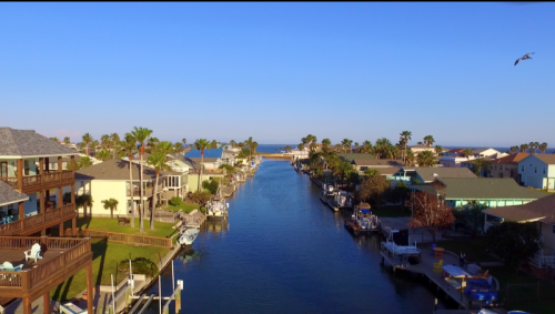 Canal-front vacation homes along a Rockport waterway with private docks